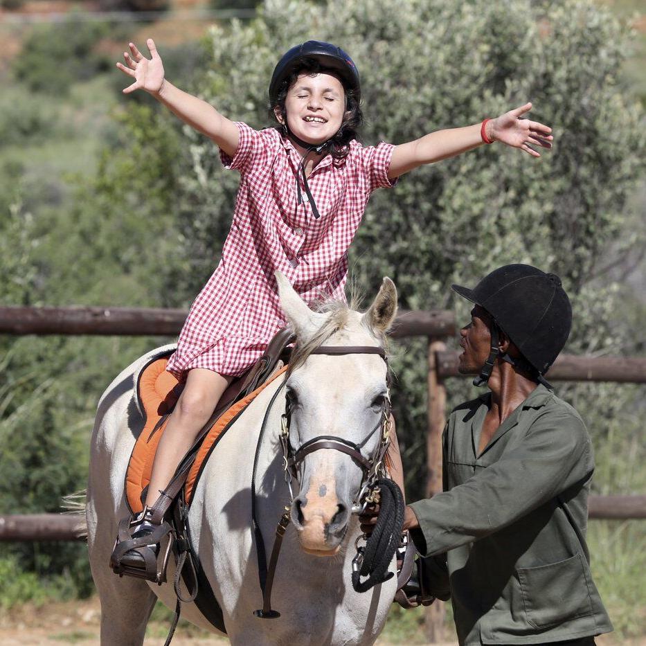 A horse therapy program in Namibia brings joy to children with learning disabilities
